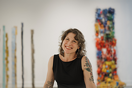 Buckham Gallery's Executive Director, Michele Leclaire, is all smiles inside the gallery on April 18, 2024. 