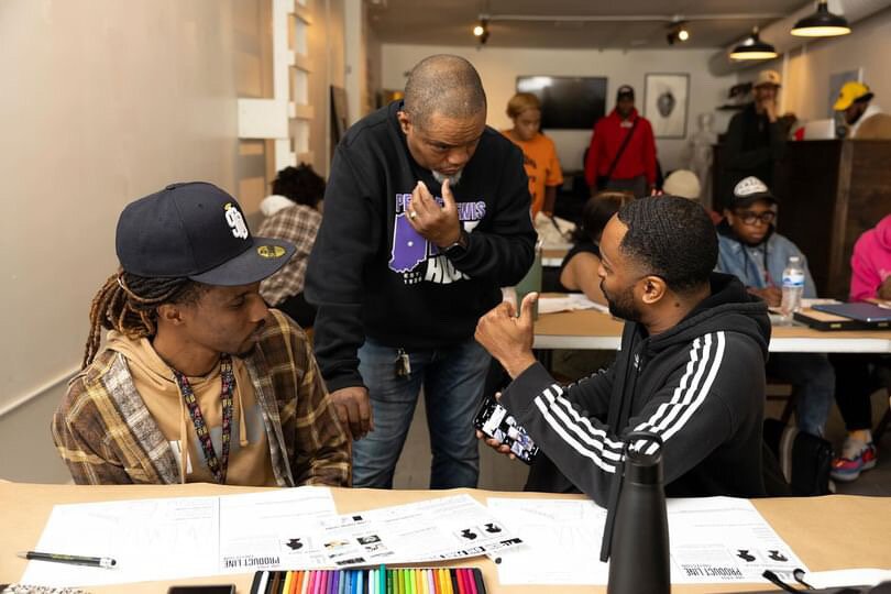 E Scott Morris (center) and attendees chop it up at BAU-HŌUSE's design workshop in collaboration with Pensole Lewis College.