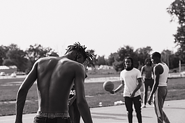 A group of young men pass the time playing basketball in the Brownell-Holmes area, pictured on Sept. 15, 2024.