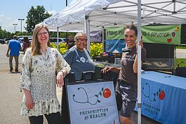 Ariane Donnelly, Anne Davis, and Tanya Andrews at the Prescription for Health booth at the Pittsfield Township Farmers Market. Prescription for Health is Washtenaw County's produce prescription program.