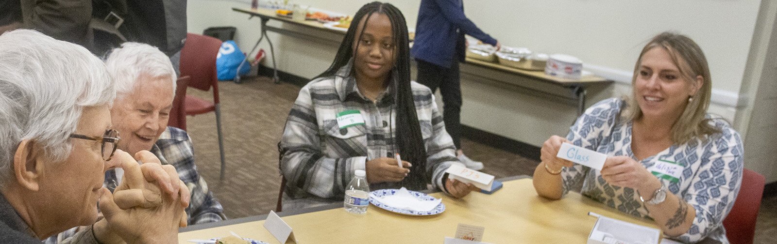 A gathering for Michigan State University's Generations Connect program, which matches MSU undergraduate students with elders in the community, at the East Lansing Public Library.