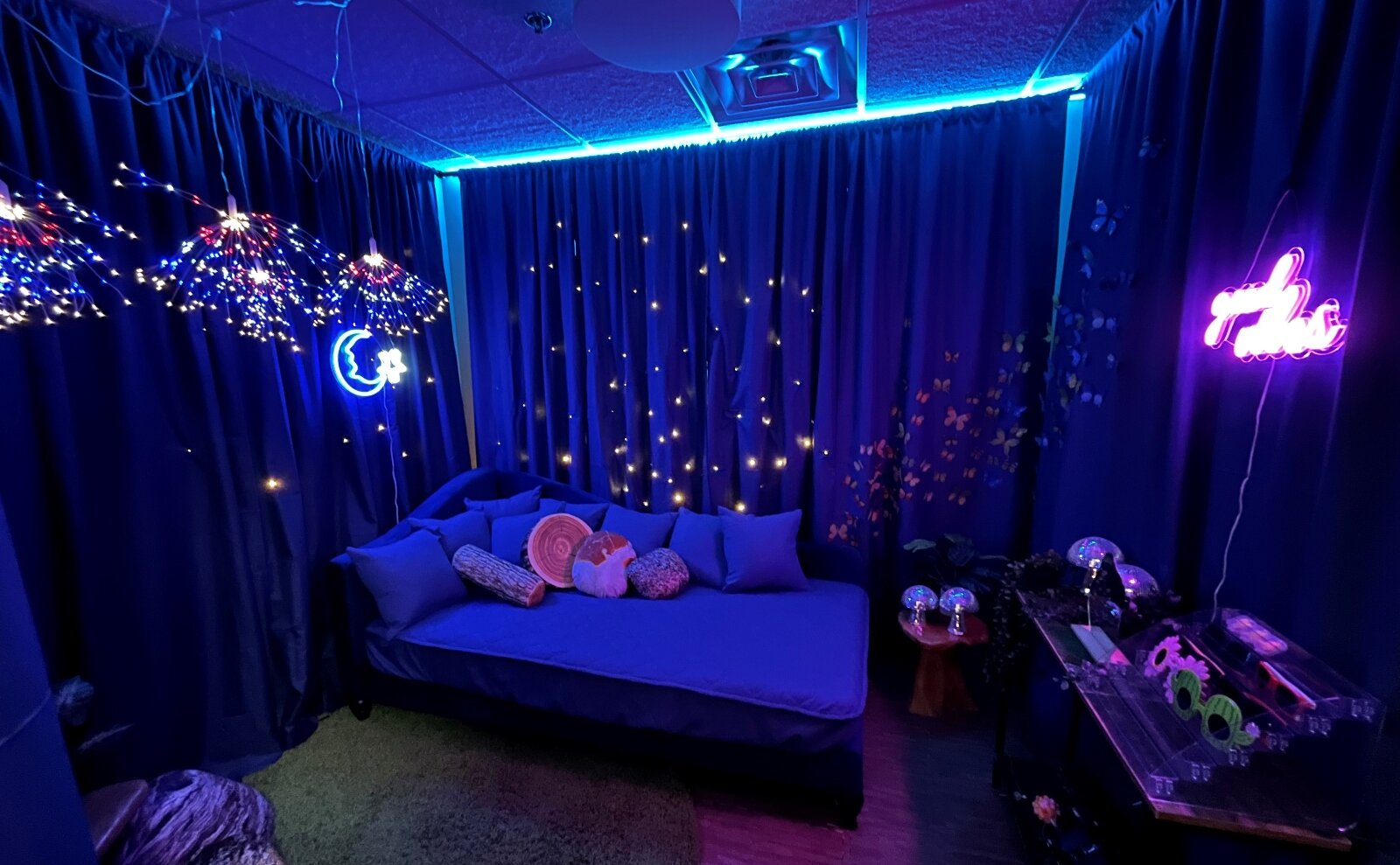 The Center for Family Health's sensory room features adjustable lighting, sound-dampening, and a daybed, providing a calming decompression space.