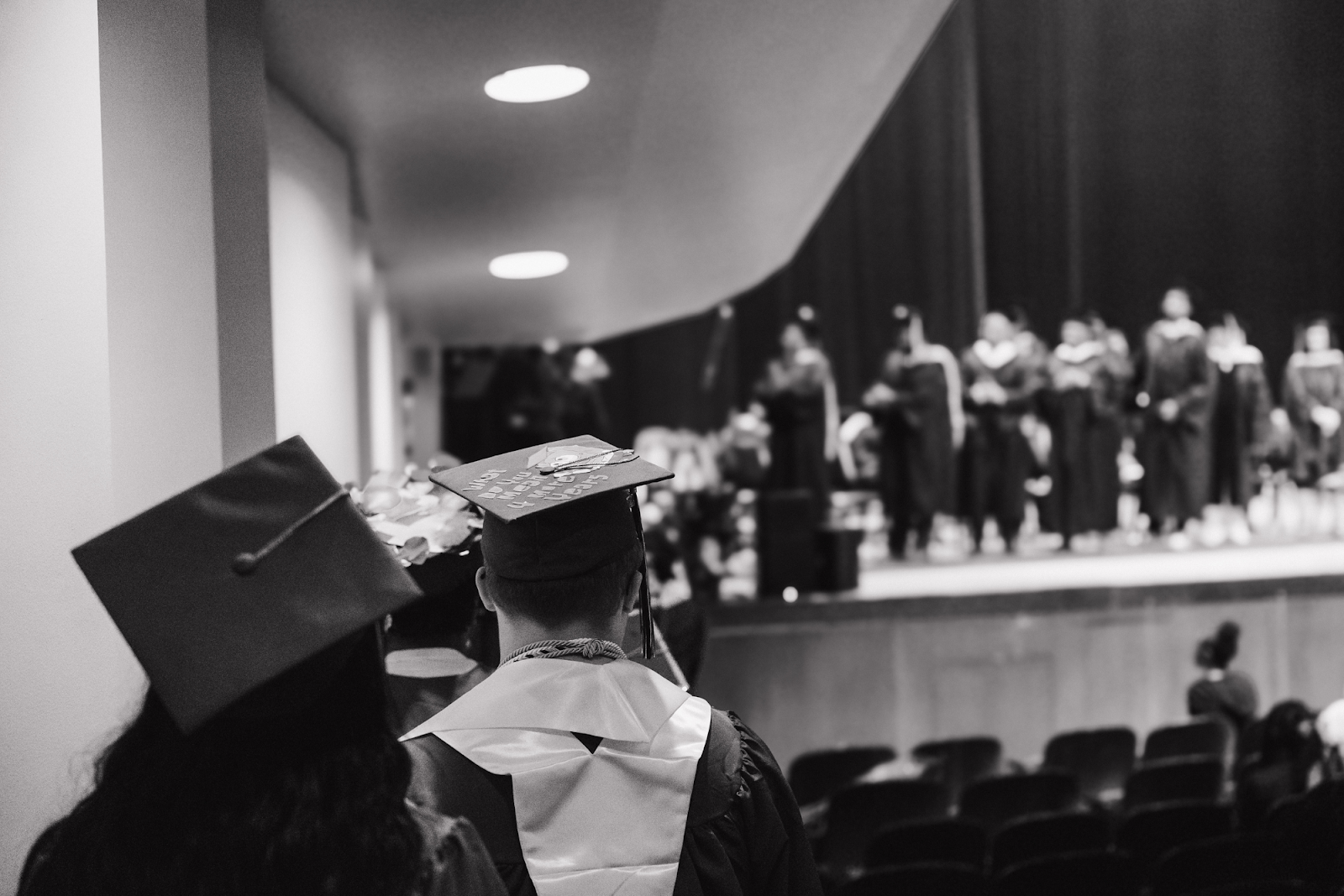 Graduates line up to have their names called in alphabetical order on June 4, 2024. 