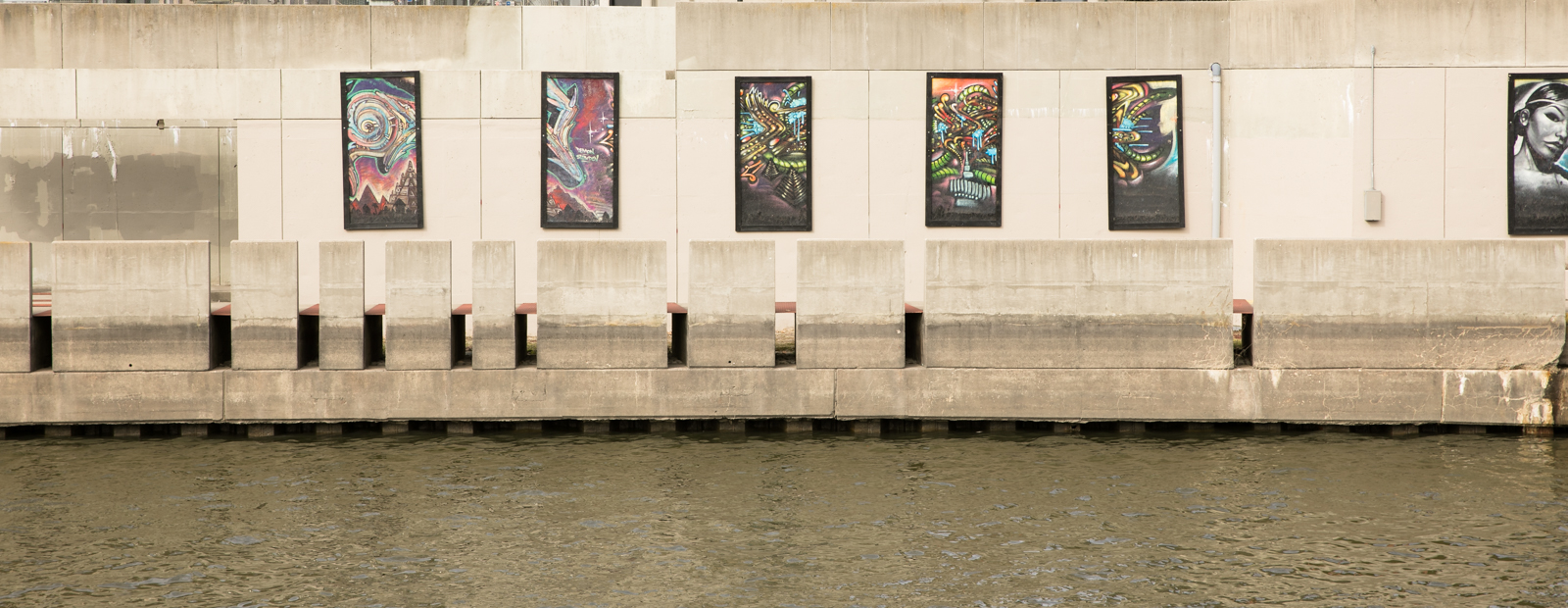 Murals line the Flint River in Riverbank Park