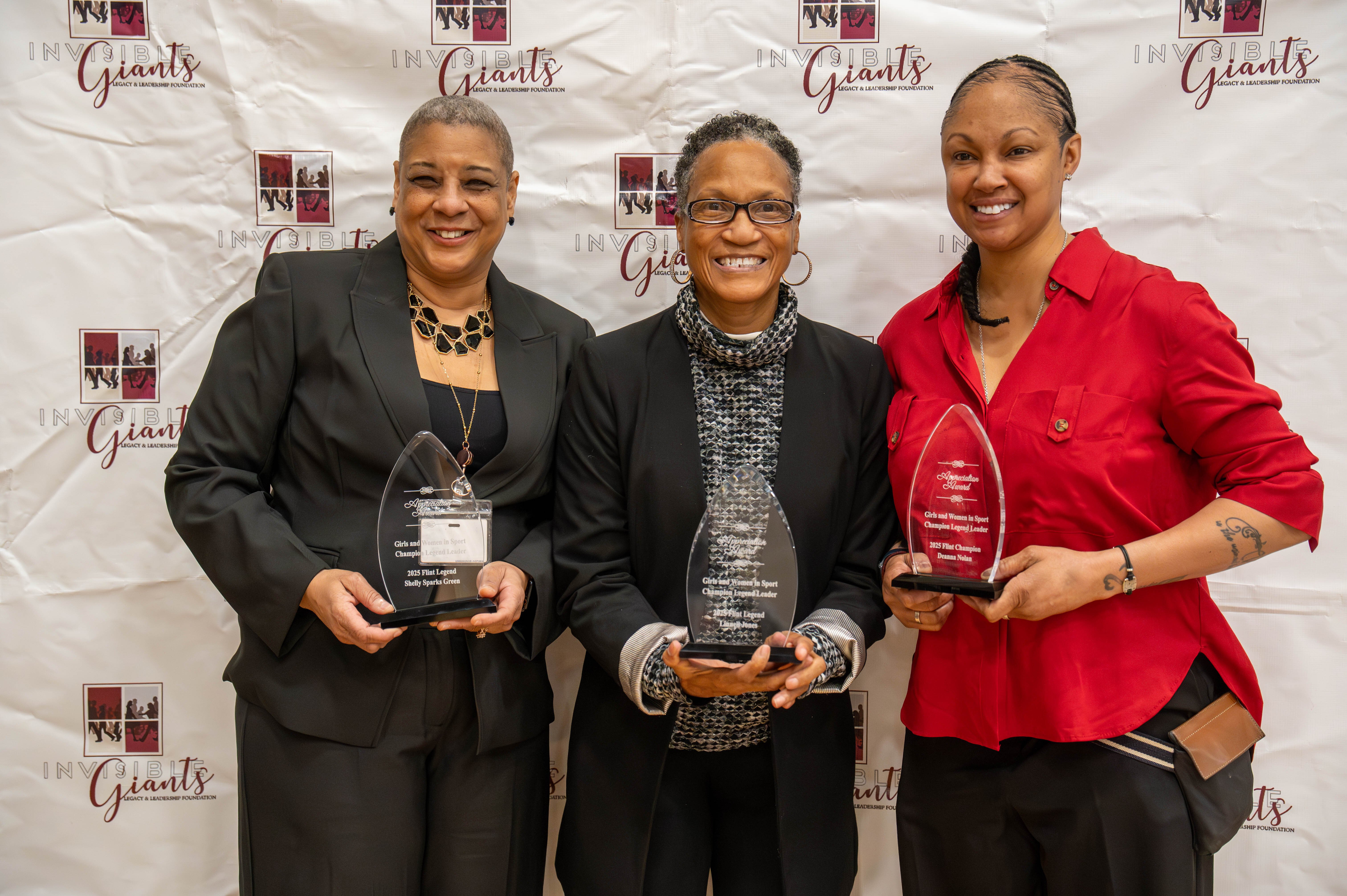 (From left to right) Shelly Sparks-Green, Linnell Jones, and Deanna Nolan with their awards during the Invisible Giants Foundation's National Girls and Women’s in Sports Day event.