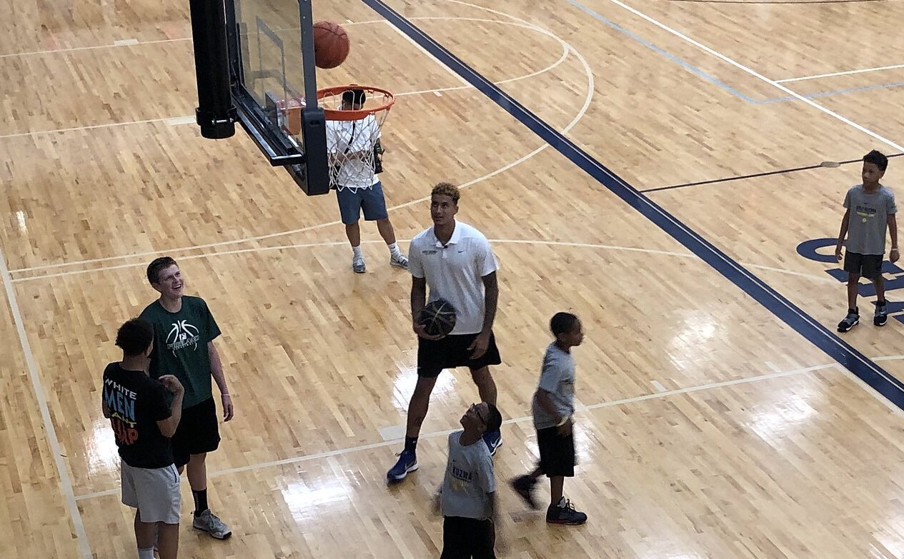 Kyle Kuzma working with young basketball players during his 2019 camp at Powers Catholic High School.