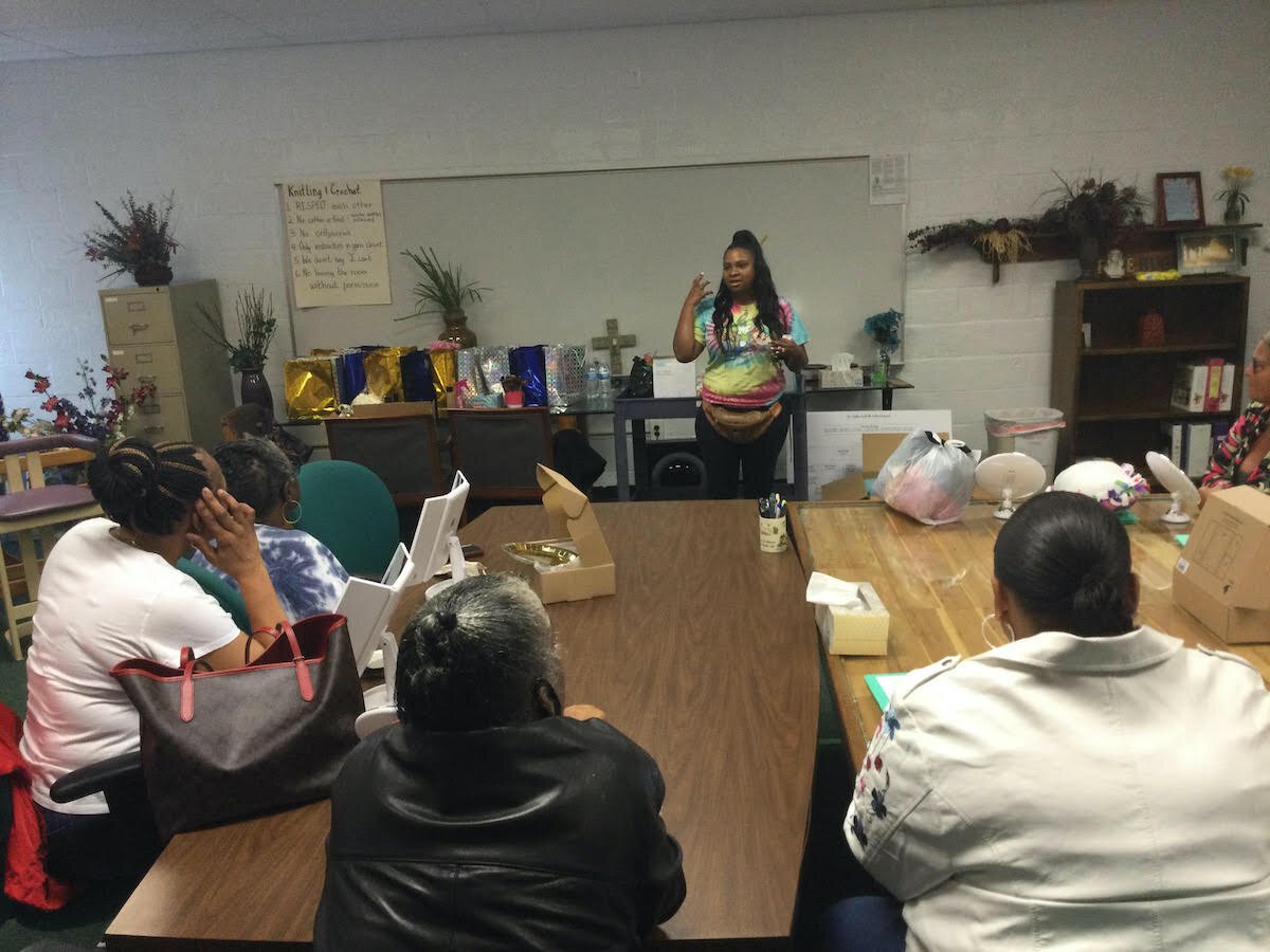 Makeup Artist Jocklyn Pierce-Mayfield discusses beauty and self-esteem during "Day of Support" event.