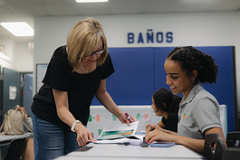 An instructor assists a student in one of the Latinx Technology & Community Center's many programs and classes, pictured on July 15, 2024.