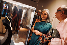 Onlookers marvel at the handcrafted jewelry on display in the 'Meditations in Gold: South Asian Jewelry' exhibit on May 16, 2024. 