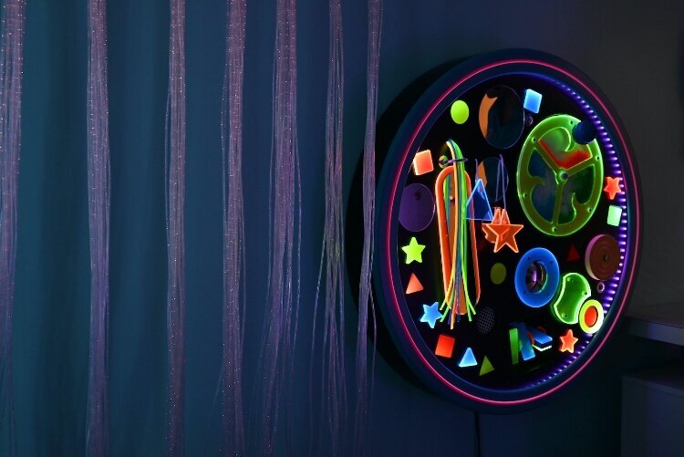 The sensory rooms features activity panels on the wall.